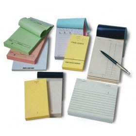 Photo of a selection of restaurant order pads - single-ply, duplicate, carbon, carbonless